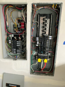 Two open electrical panels with circuit breakers and wiring, installed by Washington Generators LLC in Kent, WA.