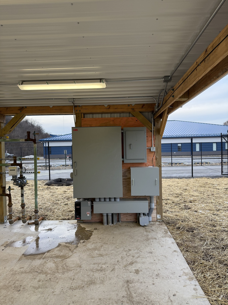 Electrical panels and conduit expertly installed on a wooden wall by Pro 1 Electric, Inc. in Parkersburg, WV