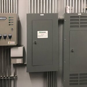 Electrical panels and conduit installed on a wall in a commercial building by T & M Electric Inc in Bismarck, ND