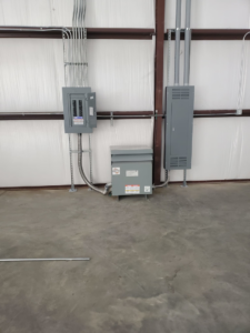 Electrical panels, conduits, and a transformer installed by Overton Power Solutions Electric in Hephzibah, GA