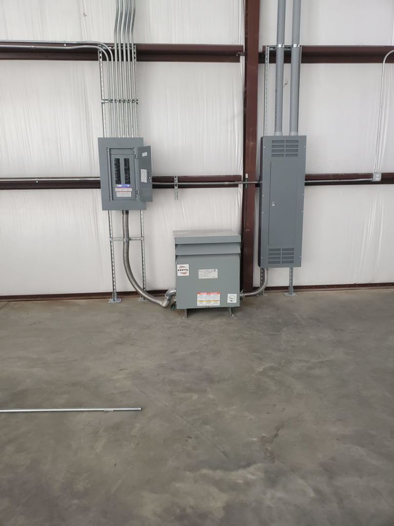 Electrical panels, conduits, and a transformer installed by Overton Power Solutions Electric in Hephzibah, GA