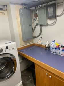 Electrical panels and conduit installed in a laundry room by Coffin Electric in Grimes, IA.