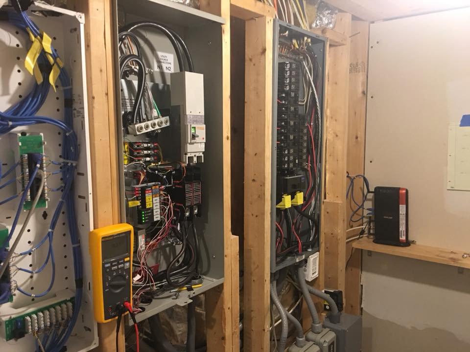 An electrician's multimeter checking complex electrical panels and wiring at a job site for ELSI Electric LLC in Rockville, MD.