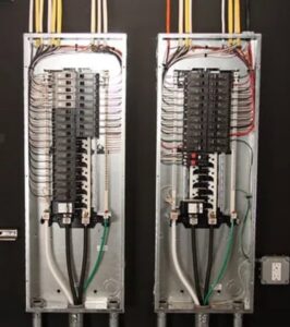 Two neatly wired electrical panels installed by Vets Electric Company in Tacoma, WA