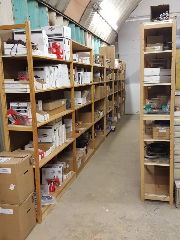 Shelves stocked with various electrical parts and components for generator service at Varitech, Inc. in Louisville, KY.