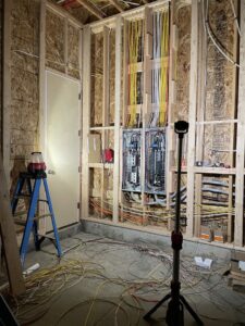 Electrical rough-in and panel installation in a room under construction by Kot Electric LLC in Kent, WA.