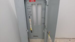 Electrical rough-in with two breaker panels installed on a wall during construction by A Renewable Electric LLC in Houston, TX.