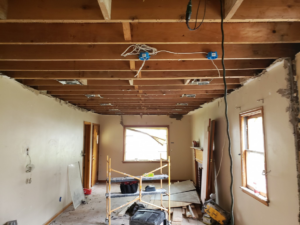 Exposed ceiling joists with new electrical wiring and junction boxes during a renovation by BMB ELECTRIC LLC in Columbus, OH.