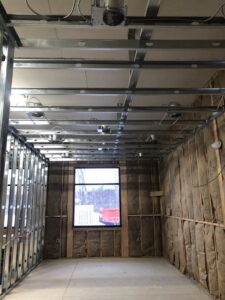 Exposed electrical boxes and conduit in a commercial ceiling under construction, showing rough-in by RHS Electrical Services in Westerville, OH.
