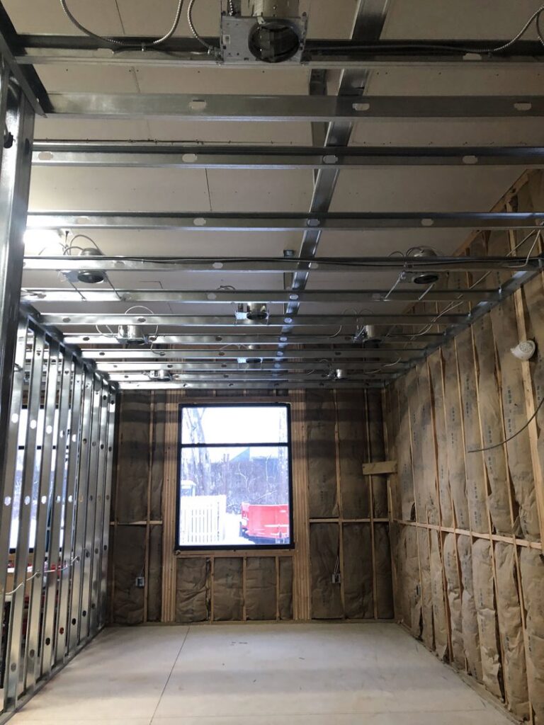 Exposed electrical boxes and conduit in a commercial ceiling under construction, showing rough-in by RHS Electrical Services in Westerville, OH.