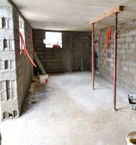 Electrical rough-in wiring visible in a concrete room during construction by Illiana Electrical in Whiting, IN
