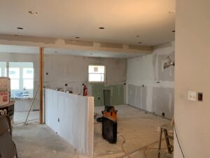 Interior of a house under renovation showing electrical rough-in with outlets and switches installed by Volta Electrical LLC in Plano, TX.