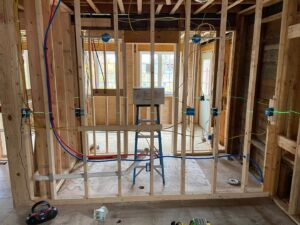 Electrical rough-in wiring and junction boxes in new construction framing by T.S.F Electric in Saco, ME.