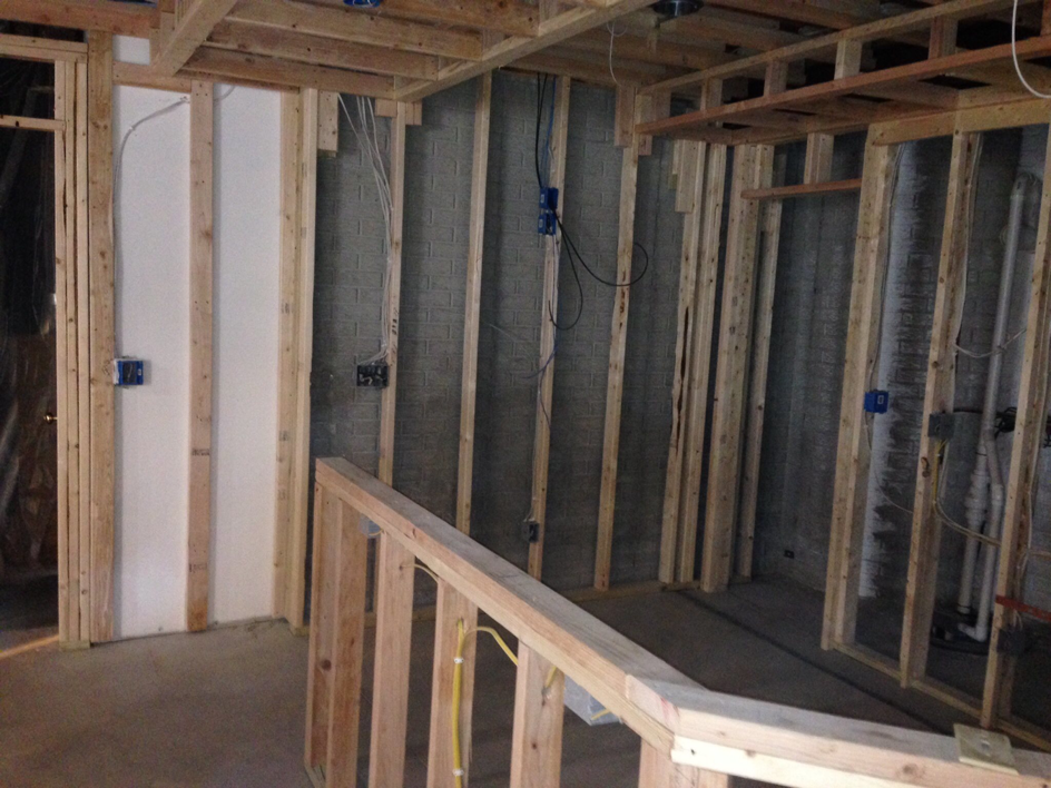 Electrical rough-in work with blue junction boxes and wiring in a new construction project by Zsori Electric in Waukesha, WI.