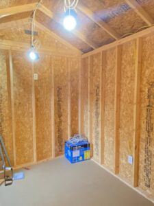 Electrical rough-in and temporary lighting installation in a shed by Ross Electric Company in Arlington, TN.