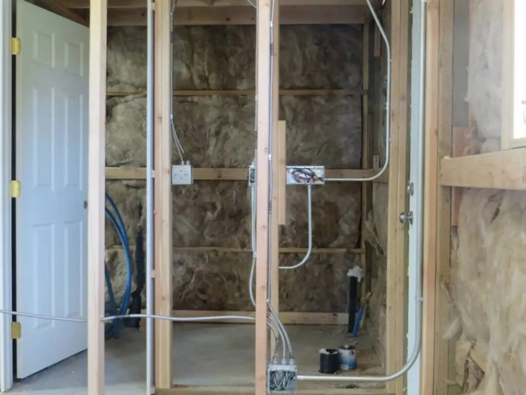 Electrical rough-in wiring installed within wall studs during a construction project by BlackRock Electrical in Pocatello, ID.