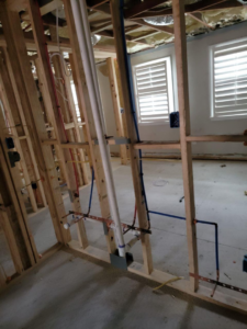 Electrical rough-in wiring visible in wall framing during new construction by D&R Construction & Electrical Services in Summerville, SC.