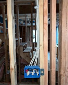 Electrical rough-in wiring and junction box installation in new construction by Next Level Pros in Lakewood, CO.