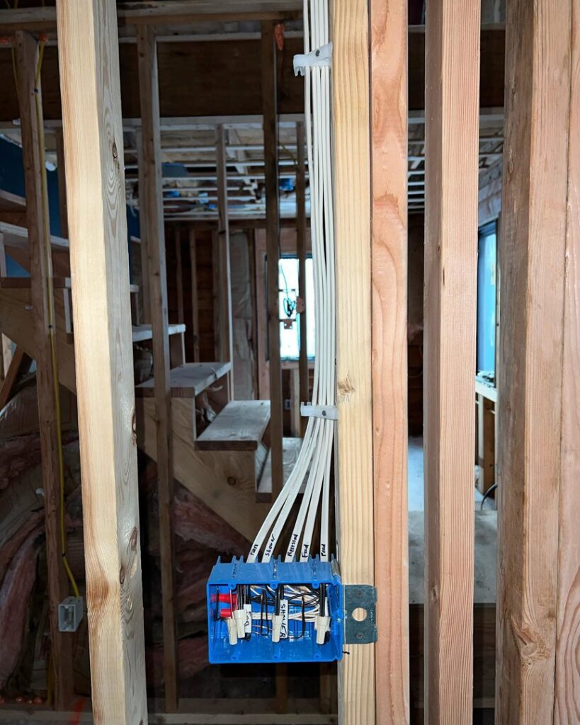 Electrical rough-in wiring and junction box installation in new construction by Next Level Pros in Lakewood, CO.