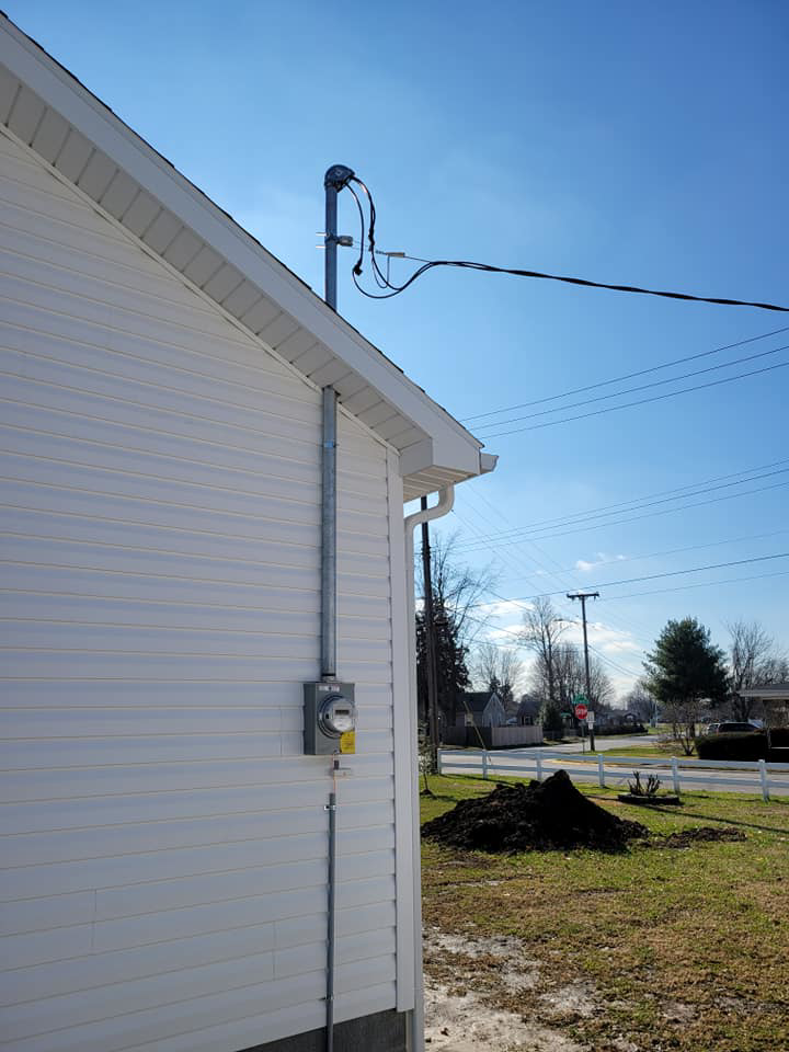 An electrical service entrance and meter box on the exterior of a home, installed by Benson Electric LLC in Owensboro, KY.