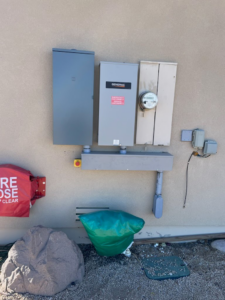 An electrical service panel and utility meter installation by Almighty Electric, Inc. in Yuma, AZ.