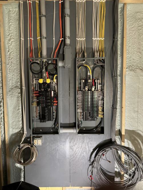 Detailed view of electrical service panel wiring and installation by Apex Electrical Solutions in Minot, ND.