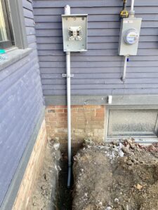 Exterior electrical service upgrade and conduit installation for a home by Detroit Voltage in Detroit, MI.