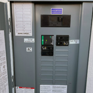 A newly installed electrical sub-panel with surge protection labels by Fuse Service HVAC & Electrical Sacramento, CA