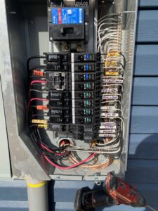 An organized electrical sub-panel with labeled circuit breakers wired by Prime Time Electric in Rock Hill, SC.