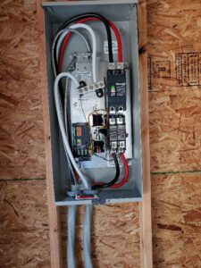 An open electrical sub-panel with neatly organized wiring by Neptune Electric in Virginia Beach, VA.