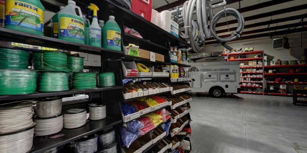 Shelves stocked with various electrical supplies and wiring at TCL Electrical and Lighting in North Aurora, IL