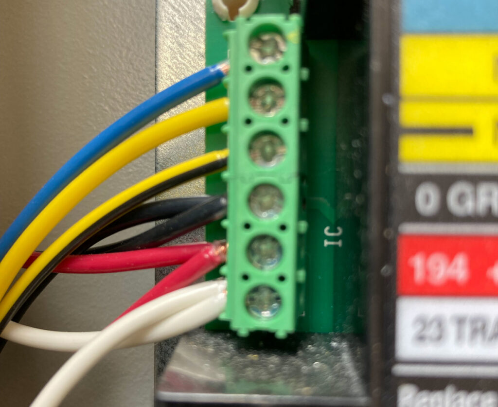 Close-up of an electrical terminal block with multiple colored wires connected by Ace Electric Inc. in Valdosta, GA.
