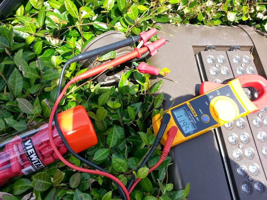 Electrical testing tools, including a clamp meter, used for troubleshooting outdoor lighting by Sterling Wiring Solutions in Pearland, TX.