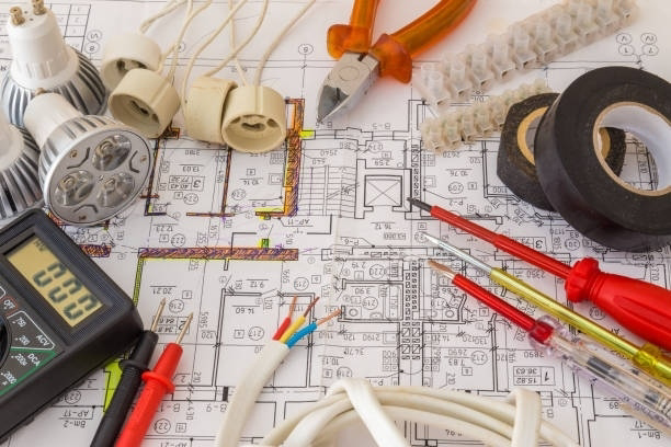 Electrical tools and blueprint for a project by Crawford Electric Co. LLC in West Columbia, SC.