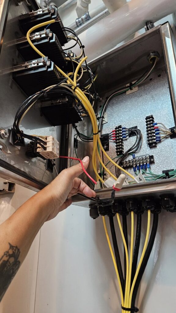 A close-up of an electrical transfer switch or subpanel with breakers, installed by Mr. Electric of Vancouver, WA.