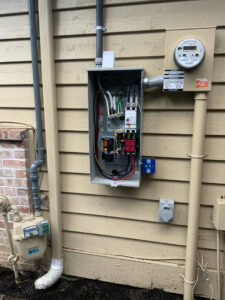 Detailed view of an electrical transfer switch wiring for a generator installation by Washington Generators LLC in Kent, WA.