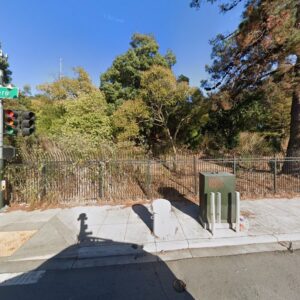 A green electrical utility box on a sidewalk, indicating outdoor electrical work by MC2 Electric Inc. in San Francisco, CA.
