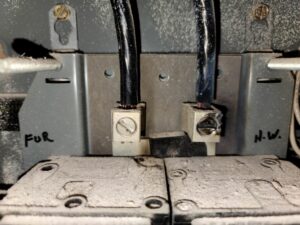 Close-up view of electrical wiring connections inside a panel, showing the detailed work performed by AA Electric Contractors in Chicago, IL.