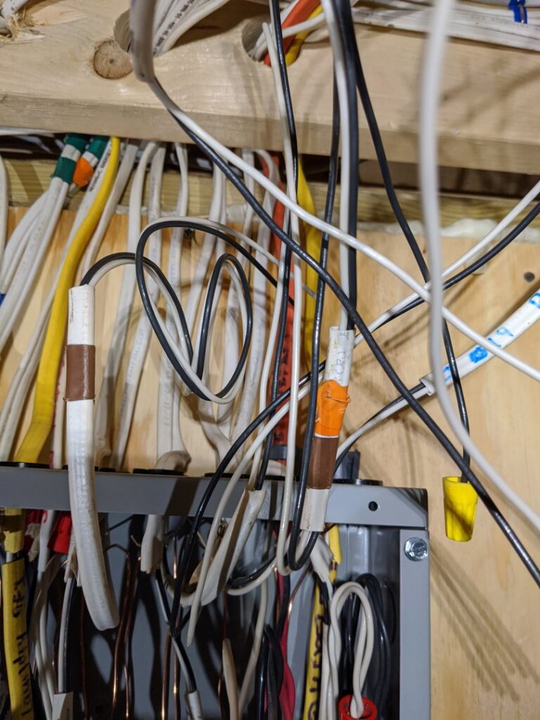 A close-up view of electrical wiring connections in a panel, demonstrating work by York Electric of Westchester in Yonkers, NY.
