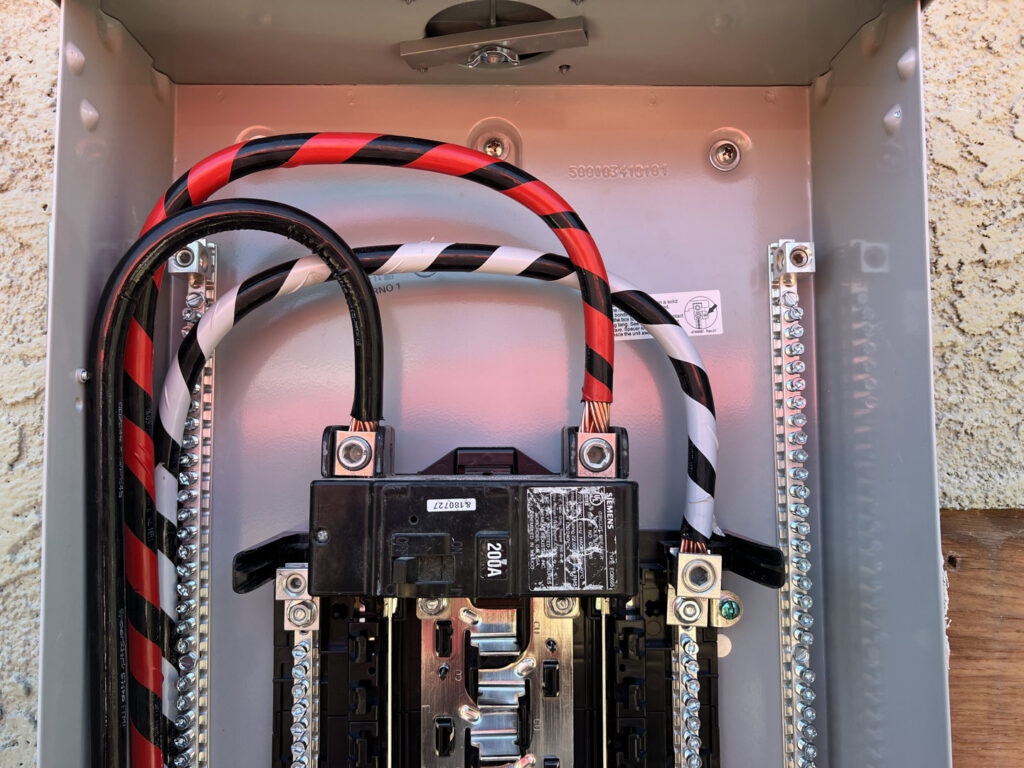 Close-up of neatly organized electrical wiring inside a service panel by HomeRun Electric LLC in Arlington, TX