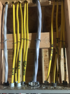 Detailed view of electrical wiring installation with labeled cables by AnchorLine Electrical in Alaska, AK