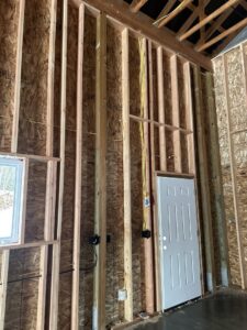 Electrical wiring and outlet boxes installed within wall studs during construction by Sunrise Electric LLC in Kalispell, MT.