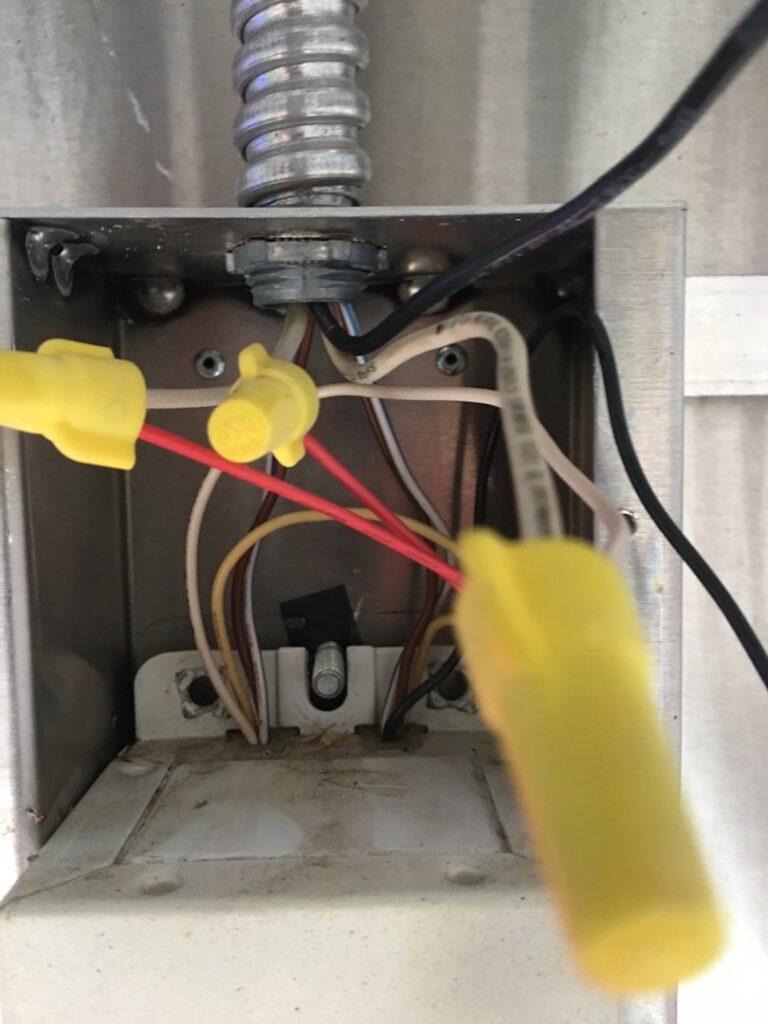 Close-up of electrical wiring connections inside a junction box by Farris Electric LLC in Glendale, AZ.