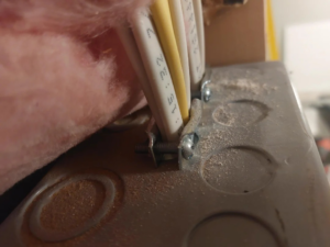 Electrical wiring secured within a junction box during an installation by Ask Electricians in Los Angeles, CA.