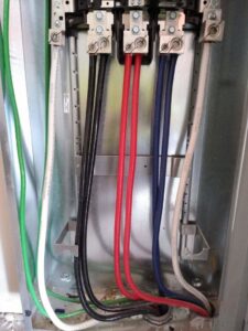 Close-up of electrical wiring and connections inside a panel during an installation by A.M.E Electrical Contracting, Inc. in Tempe, AZ.