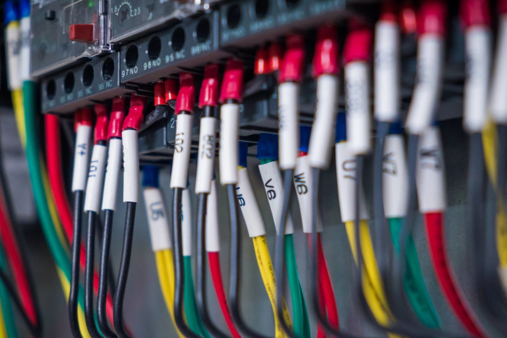 Close-up of electrical wiring and a panel, showing detailed connections by ZAP Electric LLC in Greeley, CO.