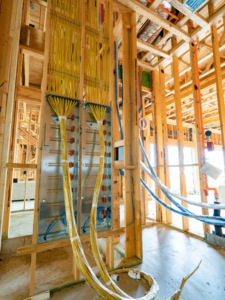 Extensive electrical wiring and panels installed in a new construction project by Powered Solutions in Farmers Branch, TX