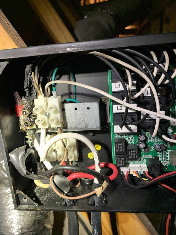 Close-up of complex electrical wiring and components being repaired by Hilman Electric LLC in Greenville, SC.