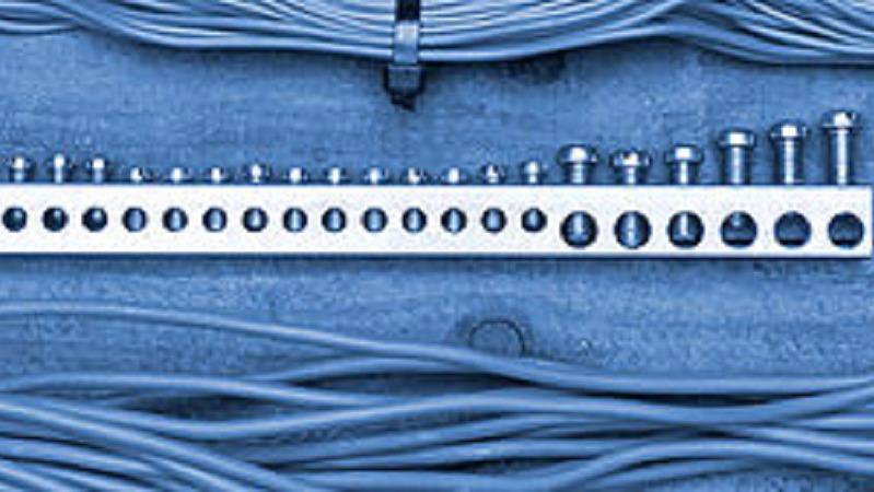 Close-up of electrical wiring connected to a terminal block, showcasing the detailed work by Legacy Electric in Westminster, CO.