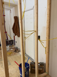 Electrical wiring running through wall studs during rough-in by J's Electrical & Maintenance Services, LLC in Columbus, OH.